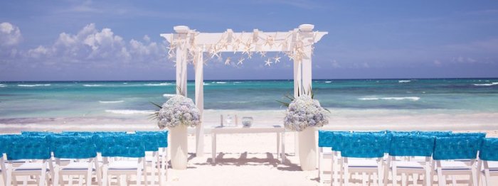 shutterstock_beach-wedding-ceremony-with-blue-water